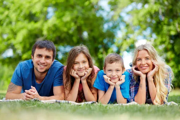 A happy family lying row.